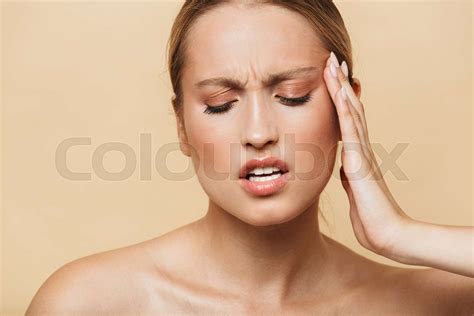 Image Of Unhappy Half Naked Woman Rubbing Her Temples Stock Image