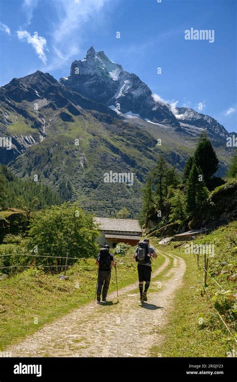 Hikers In Val D Anniviers Valais Stock Photo Alamy