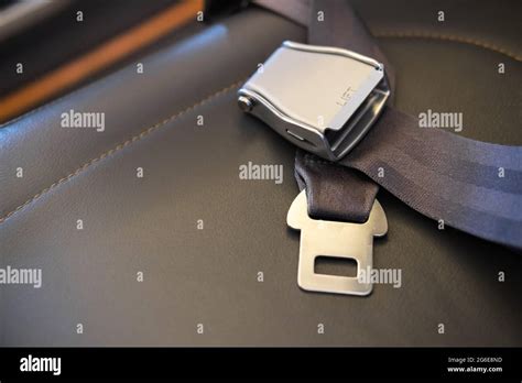 Seat belt lies on the aircraft seat Flight safety concept Stock Photo ...