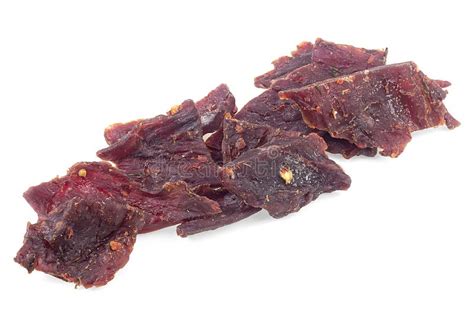 Dried And Spiced Beef Jerky Pieces Isolated On White Background Stock