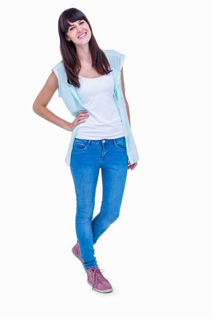 Premium Photo Pretty Brunette With Hand On Hips Smiling At Camera