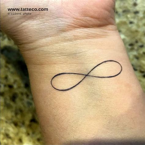 Small Fine Line Infinity Symbol Semi Permanent Tattoo