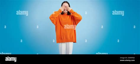 Portrait of cheerful cute asian girl waits for surprise, shuts her eyes ...