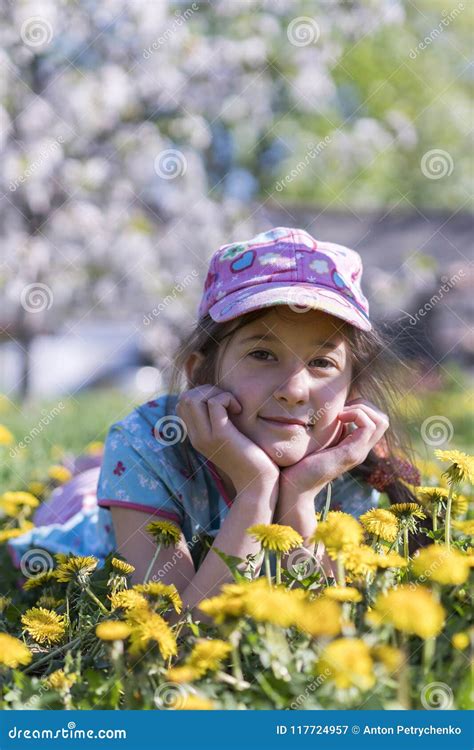 Little Girl Lying on Grass in Flower. Outdoor Stock Image - Image of ...