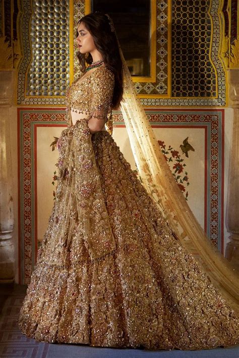 Buy Gold Net Embroidered Floral Sweetheart Metallic Bridal Lehenga Set