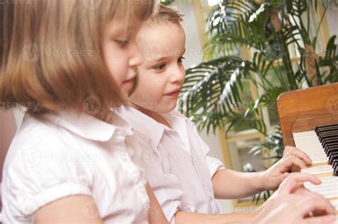 Children Playing the Piano 16359557 Stock Photo at Vecteezy