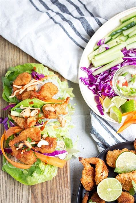 two plates filled with different types of food on top of a wooden table ...