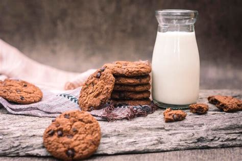 Premium Photo Close Up Of Cookies And Milk On Table