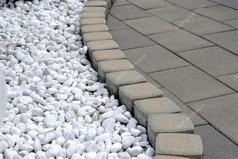 Flower bed border made of pebbles and stones — Stock Photo ...