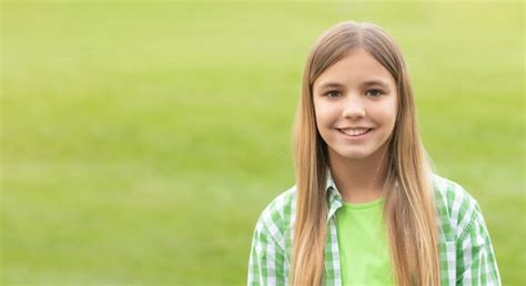 Premium Photo Portrait Of Happy Tween Girl With Smiling Face Blurry Outdoors Copy Space