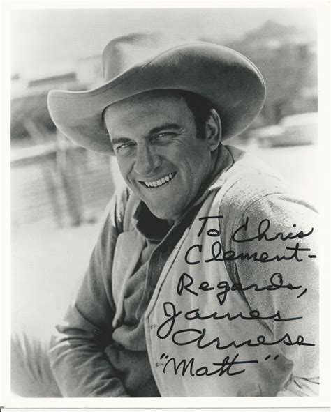 A Black And White Photo Of A Man Wearing A Cowboy Hat With Writing On It