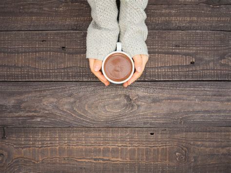 Women S Hands Hold A Mug With Hot Cocoa Stock Photo Image Of Table