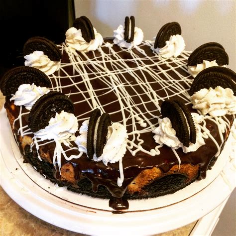 Oreo Cheesecake With Chocolate Ganache And White Chocolate Drizzle