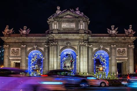 Premium Photo | Lights of christmas decorations in puerta de alcala in ...