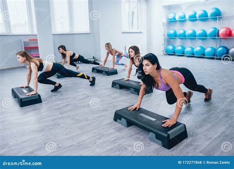 Young Fitness Women Using Step Platform At The Gym Crossfit Training