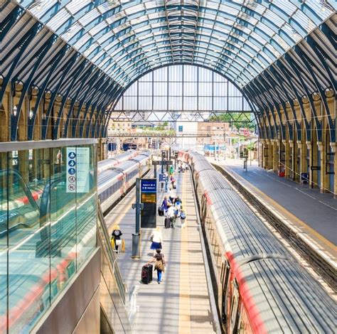 London England Train station with people walking - Travel Off Path