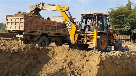 Jcb Backhoe Cutting Soil And Loading In Dump Truck Dump Truck