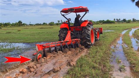 Tractor Kubota M Plow Field Sand In The Rain