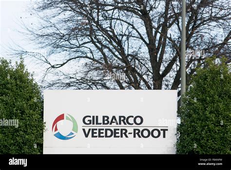 A logo sign outside of the headquarters of Gilbarco Veeder-Root in ...