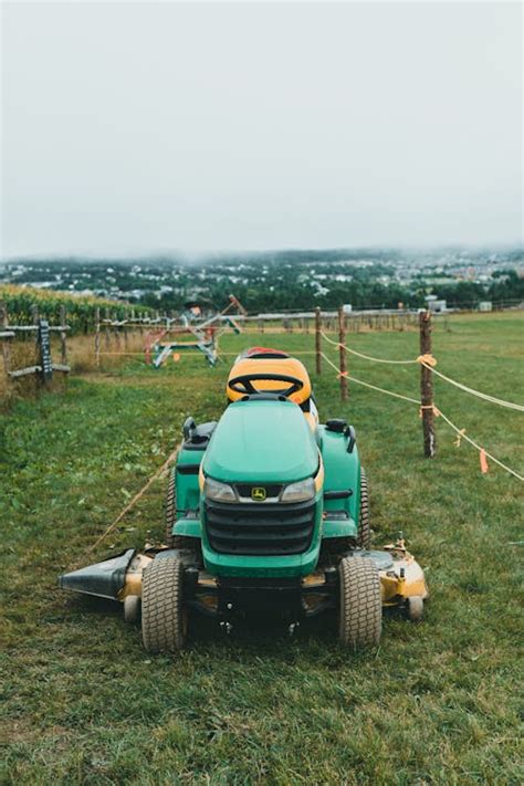 Green Lawn Mower on Green Grass Field · Free Stock Photo