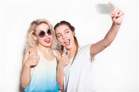 Premium Photo Two Friends Taking Selfie