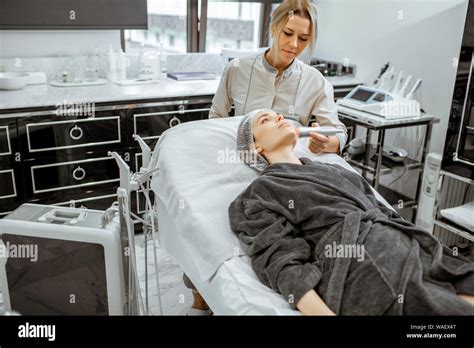 Female Cosmetologist Making Oxygen Mesotherapy To A Woman At The Luxury