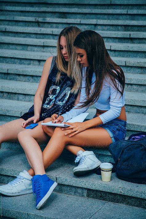 Two Girls Studying Outdoors Del Colaborador De Stocksy Danil Nevsky