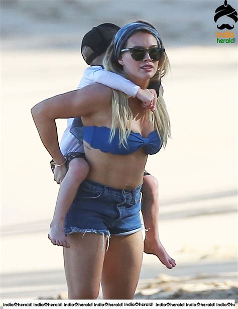 Hilary Duff Wearing A Bikini Top And Shorts At The Beach In