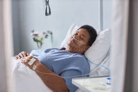 Senior Female Patient Sleeping on Bed in Hospital Room Stock Photo ...