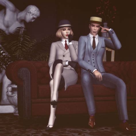 Two Mannequins Dressed In Suits And Hats Sitting Next To Each Other On