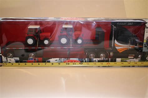 New Ray Peterbilt Flatbed Semi With Farm Tractor Load Scale Boxed