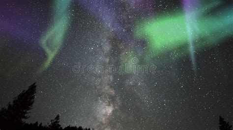 Aurora Solar Storm Milky Way Galaxy Time Lapse Over Alpine Forest In