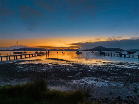 Soft And Hazy Aerial Sunrise Waterscape With Boats Stock Photo Image