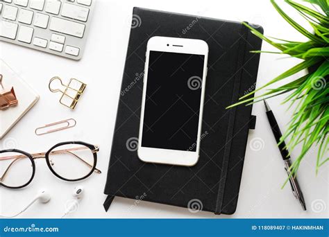 Top View Of Smartphone On Office Desk Table With Modern Accessories