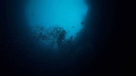 Download An Eerie Underwater Scene Of A Deep Sea Abyss