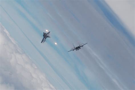 Dora 9 Diecast: F-22 Raptor dogfighting against F-15 Eagle at close range.