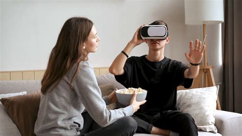 Couple Playing Virtual Reality Box While Having Popcorn · Free Stock Video