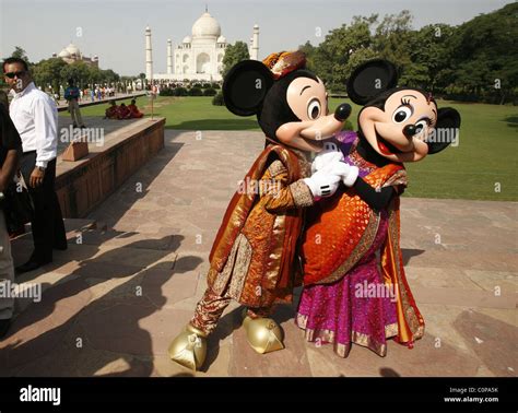 Mickey Mouse and Minnie Mouse pose at the Taj Mahal in Agra, India. The ...