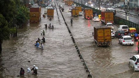 Delhi Waterlogged Roads Traffic Jams Collapsed Walls Rain Batters