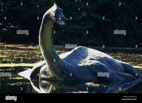 United Kingdom Scotland Loch Ness statue of the monster Nessy in water Stock Photo - Alamy