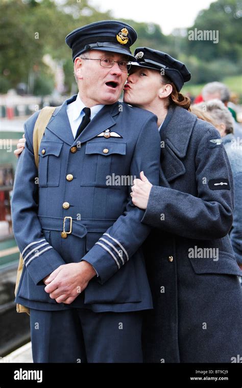 RAF Officer Open Mouthed in Surprise by Kiss from Junior Officer Stock ...