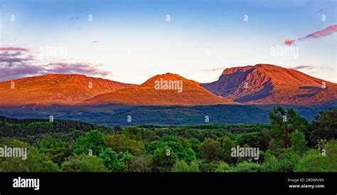 Sunset on Ben Nevis, Aonach Beag and Aonach Mor (R to L) Scottish mountains seen Banavie from ...