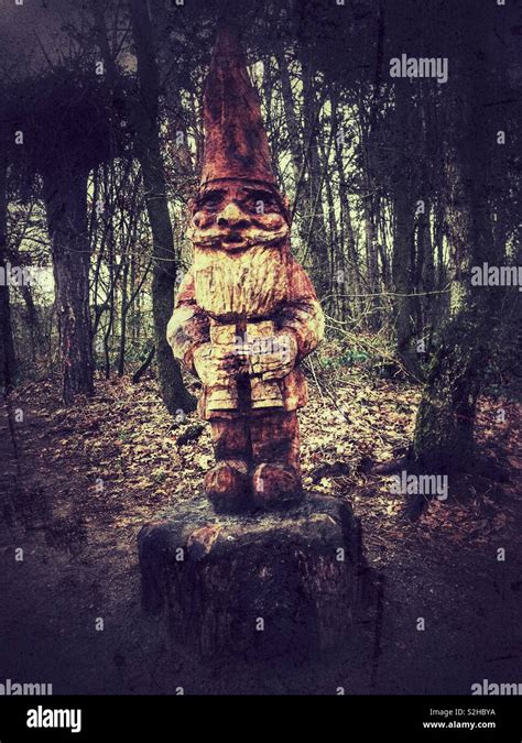 Forest gnome woodcarving Stock Photo - Alamy