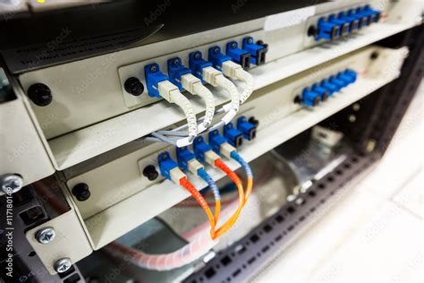 Fiber optic cable connect to ethernet switch mount on rack. Stock Photo ...