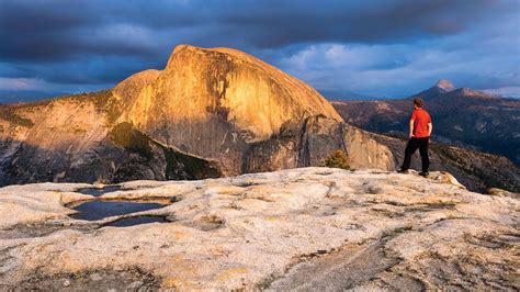 North Dome Hiker At Sunset In Yosemite Yosemite National Park Trips