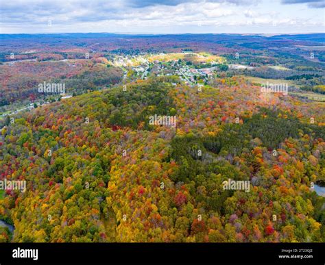 An aerial view of Thomas, West Virginia among the mountains and fall ...