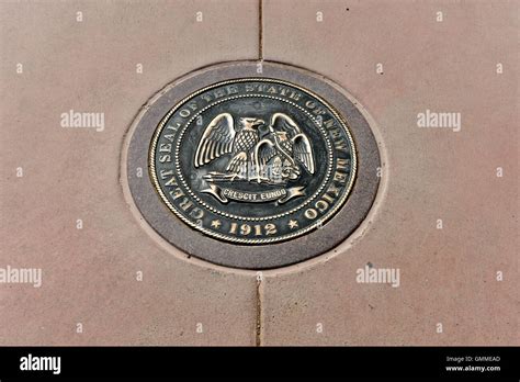 New Mexico state seal at the Four Corners Monument Stock Photo - Alamy