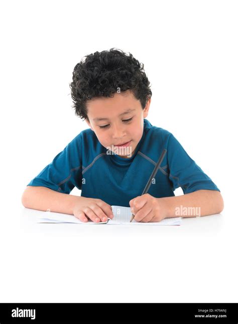 Young Boy Writing His Homework Isolated on White Background Stock Photo ...