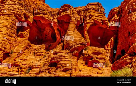 The Erratic Red Aztec Sandstone Formation Near The Arch Rock Campground Under Clear Blue Sky In