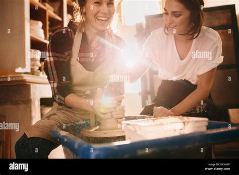 Woman Potter Teaching The Art Of Pot Making Woman Working On Potters